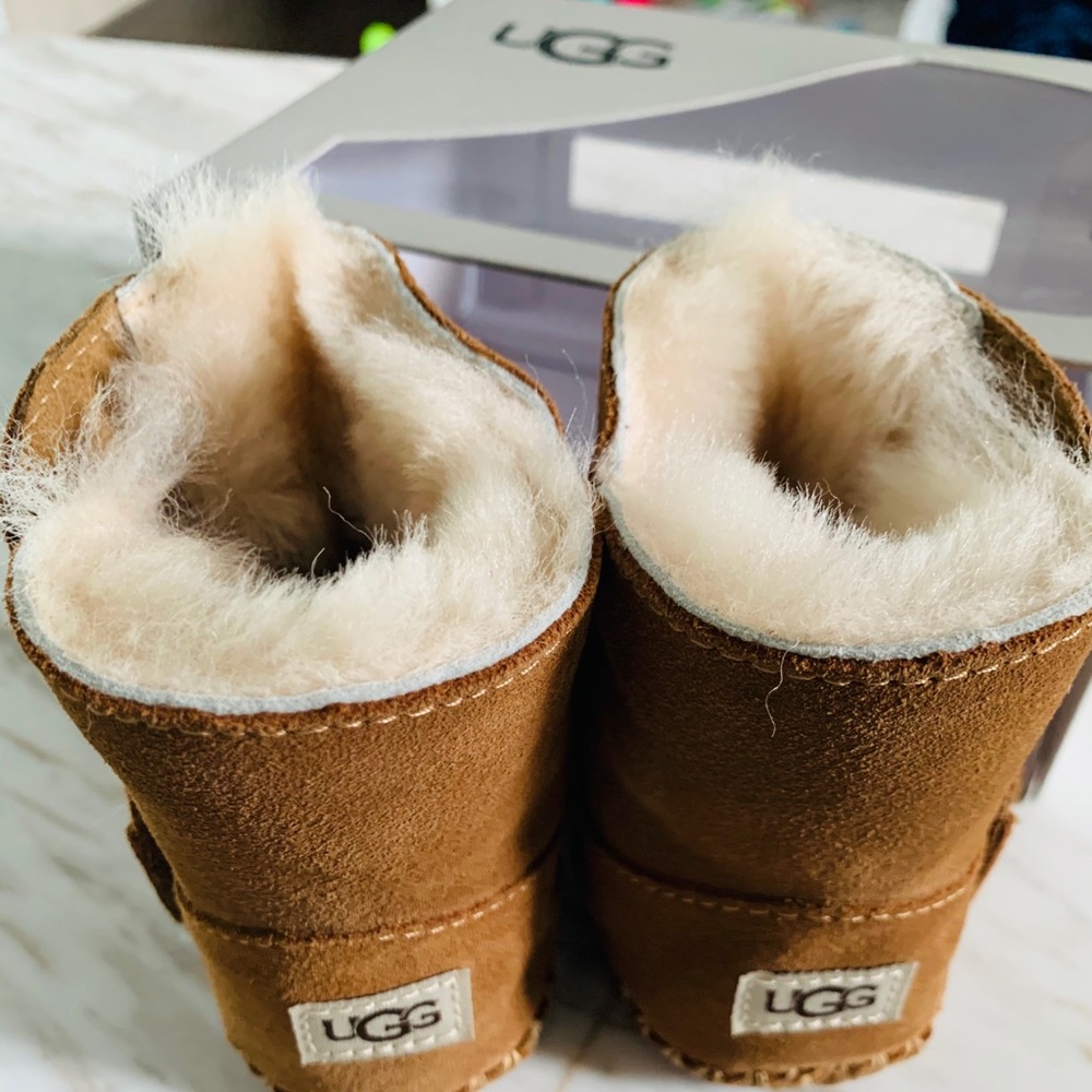 UGG Baby booties. Size 02/03. New in box.